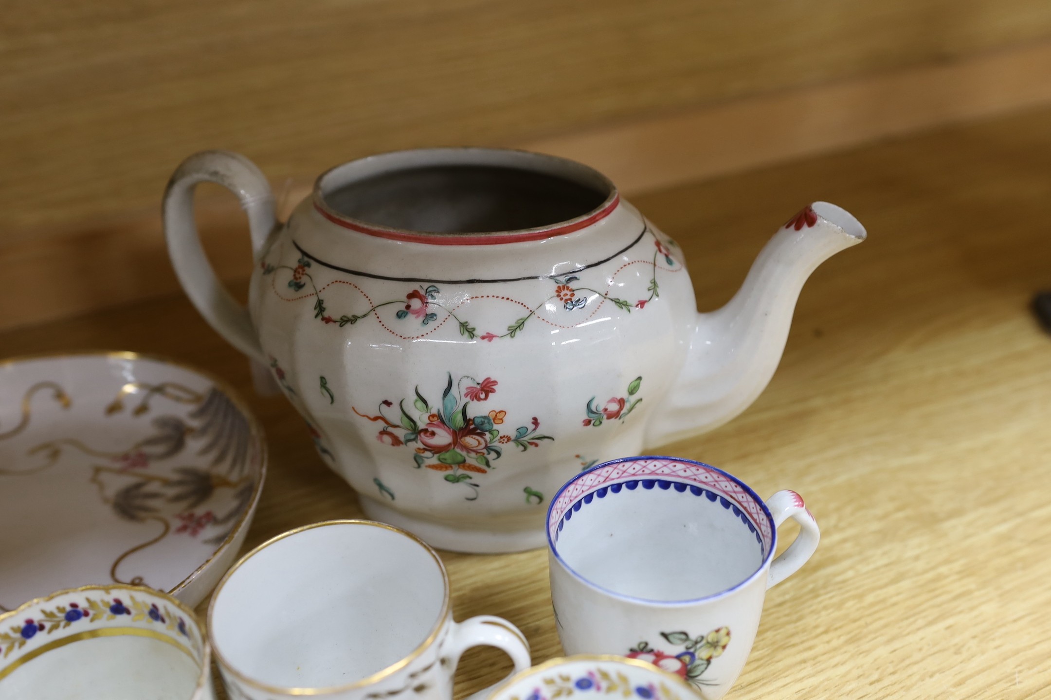 A Newhall saucer dish painted with pattern 85, octagonal Newhall-type spoon tray, clip-handled coffee cup painted with flowers, two ridge handled coffee cups, New Hall pattern 430 coffee cup, Newhall teapot and eight oth